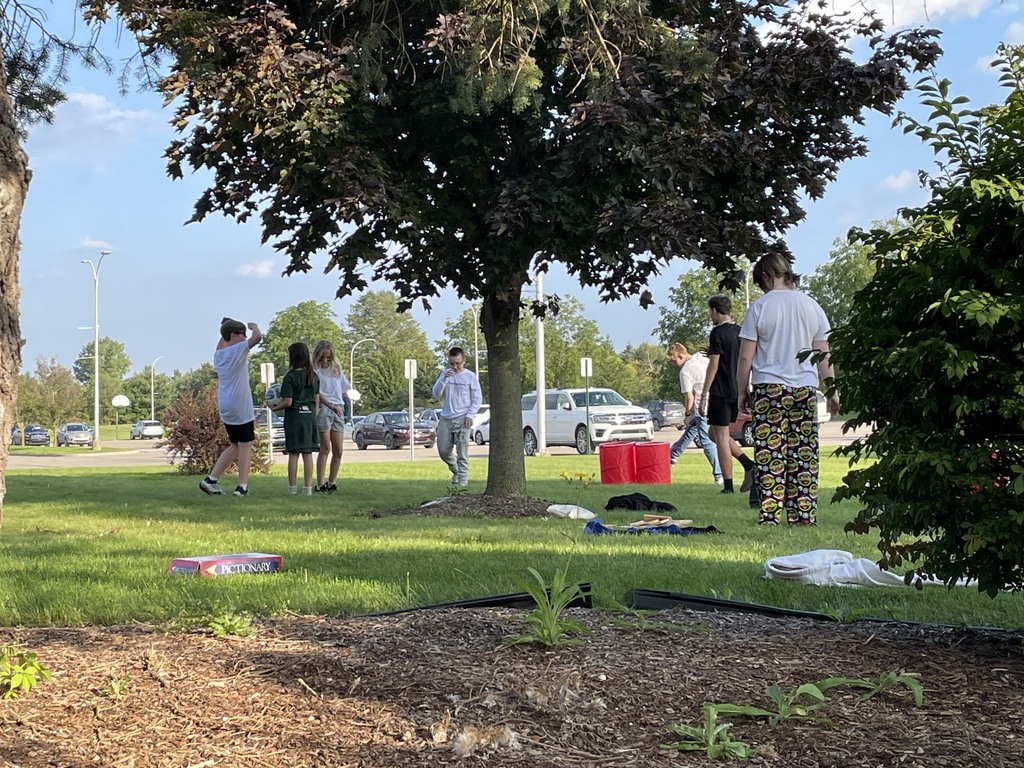 students standing on the grass